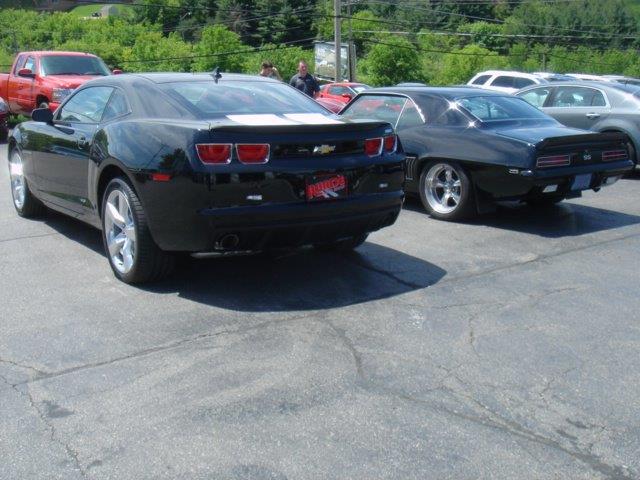 two Camaros on a dealer's lot