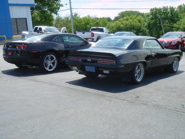 tail lights of two Camaros