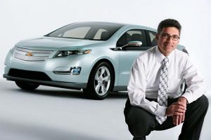 Andrew Farah pictured with the Chevy Volt Hybrid Car