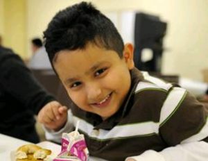 smiling school kid taking part in the Foodpack Program in Dubuque