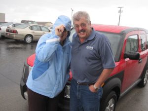 Peg and Al Kloft standing in the rain