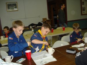 Sue Hanger's cub scout pack working on a project