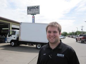 Jeff Schmitt standing in front of a box truck at the Runde PreDriven store