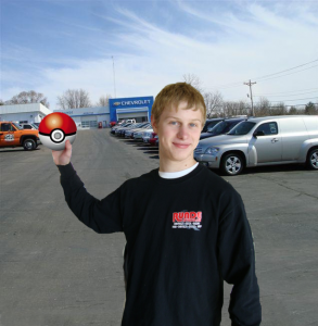 Mike Hafeman holding a pokeball outside Runde Chevrolet