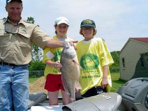 Maury Schmerbach Teaching the Kids How to Handle a Fish.