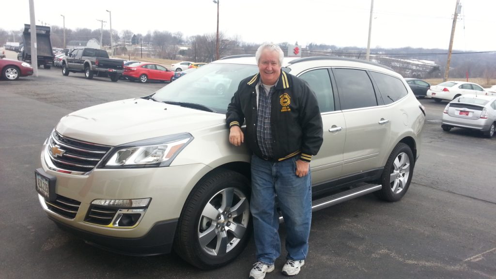 Richard Cottrell of Dubuque IA standing beside his new Chevy Traverse