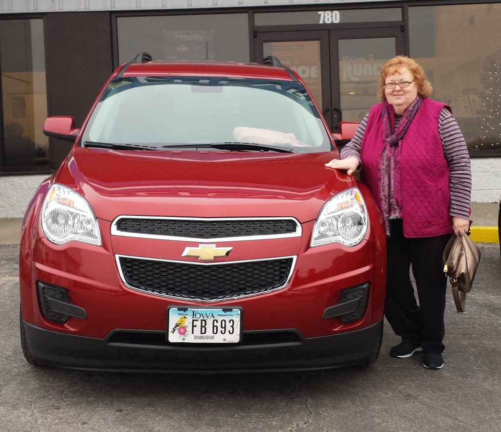 Ellen picture beside her new Chevy Equinox