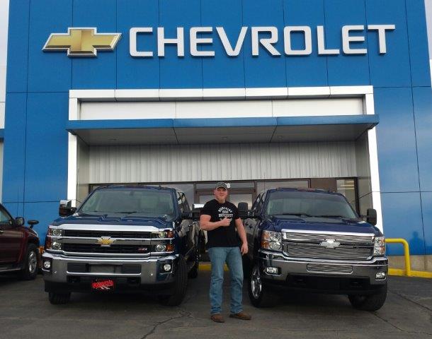 Tyler Wood standing beside his new Silverado