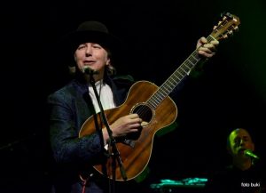 Nenad Bach playing a guitar