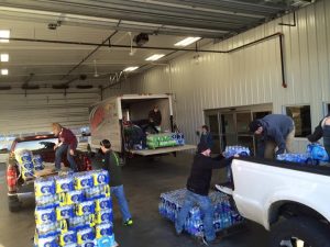 Resources Unite in Dubuque loading trucks