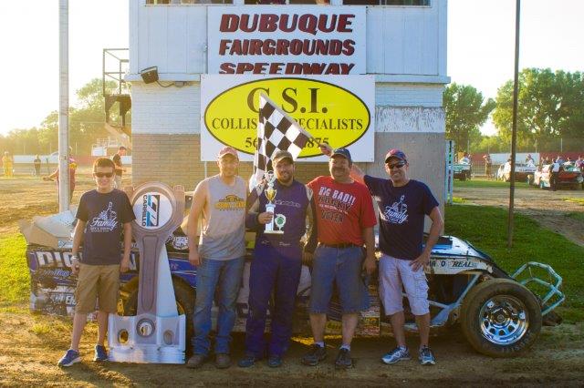 Wes and his crew holding his trophy at the Dubuque Speedway