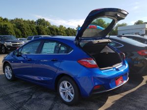 blue Chevrolet Cruze with the hatchback opened 