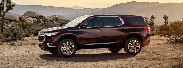 2018 Traverse parked out in some desert-looking place in front of a distant picturesque mountain range