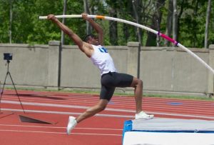 Rick Valcin pole vaulting at a track and field competition