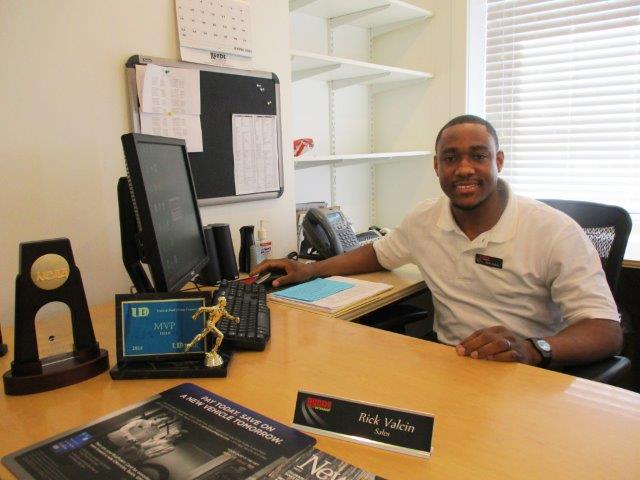 Rick Valcin sitting at his desk at Runde Chevrolet