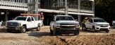 Chevrolet commercial grade trucks near construction site