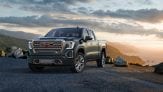 2019 GMC Sierra Denali shown in front of setting sun