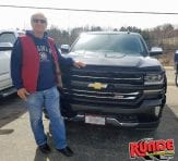 Runde Chevrolet Customer Leonard H. pictured in front of new Colorado truck