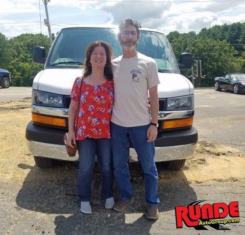 Jim and Angie Mullen pictured in front of their Chevrolet Express