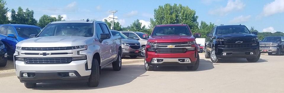 photo of 3 different new Chevy Silverado's on the lot at Runde Chevrolet