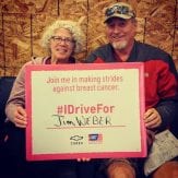 Terry and Patty Shafer holding an I Driven For Sign