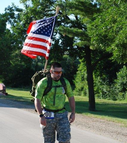 Run4Troops participant carrying a US flag