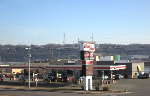 Gas stating sign showing current fuel prices in downtown Dubuque Iowa