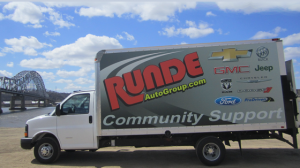 Runde Chevy truck parked in front of Julien Dubuque Bridge