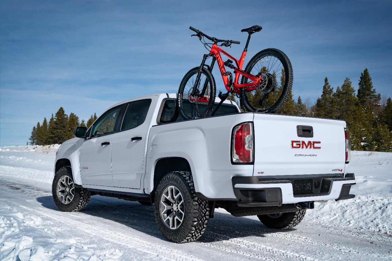 GMC Canyon AT4 rear shot with a mountain bike in the truck bed