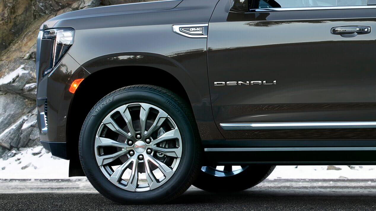 close-up on chrome wheel on new GMC Yukon Denali