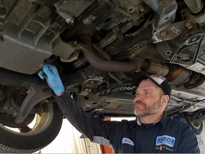 Dubuque area oil change being performed on a vehicle