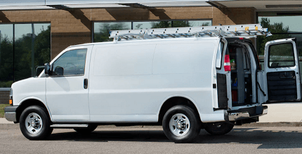 white Express Cargo van with ladder rack