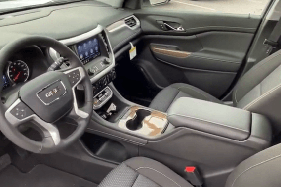 middle console storage area of a new GMC Acadia near Dubuque