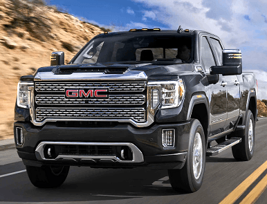 black GMC Sierra HD driving on the highway