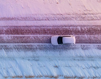 SUV with undercoating and rust-proofing protection driving in the snow