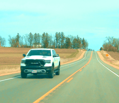 white Ram pickup truck passing on highway