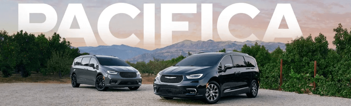 New Chrysler Pacifica vans parked on a hillside