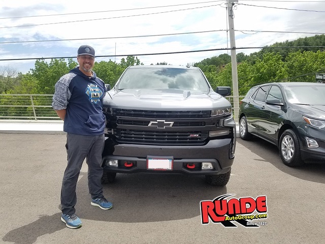 Eric Munson of Dubuque at Runde Chevrolet with his new Silverado