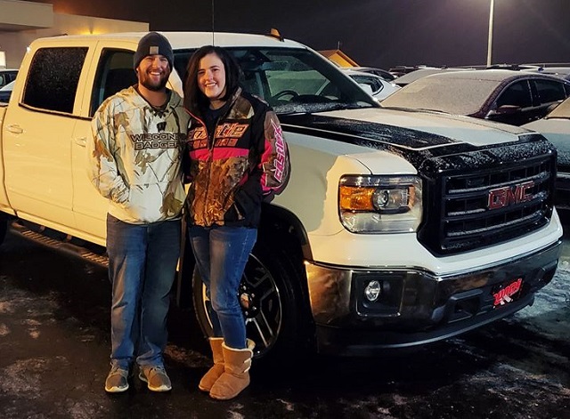 Megan and Joey from Lancaster, Wisconsin look extremely happy for a reason.  Oh, maybe it's the new Silverado parked behind them that they just purchased from Runde Auto Group