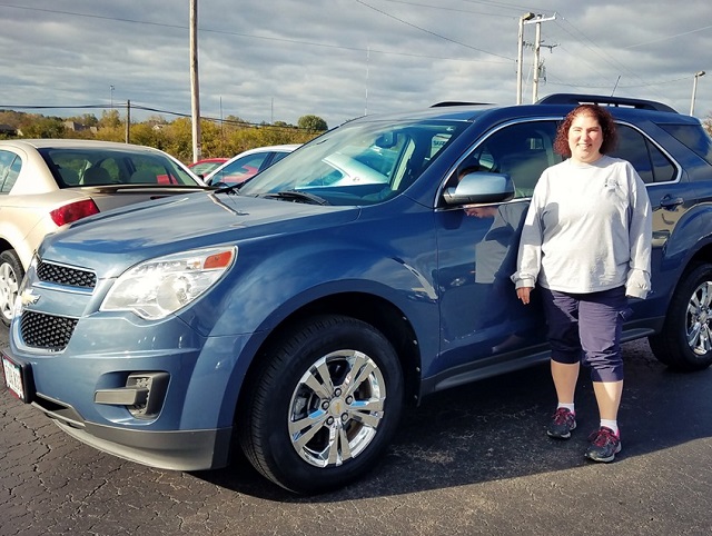 Shawn S. from Dubuque, Iowa is shown here with the 2011 Chevy Equinox she just purchased from the Runde Predriven store